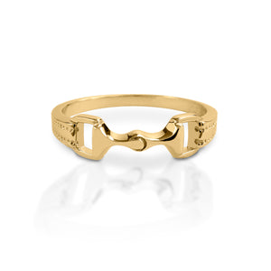 The Kelly Herd Bit Ring is made in your choice of white or yellow gold, with a perfectly crafted tiny snaffle bit. At 6mm wide, this is the sort of ring you wear everywhere and with everything!  Features      Snaffle bit ring     Available in white gold or yellow gold     6mm wide