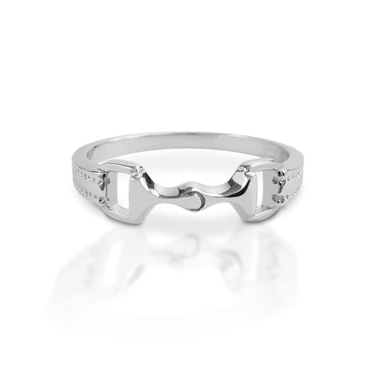 The Kelly Herd Bit Ring is made in your choice of white or yellow gold, with a perfectly crafted tiny snaffle bit. At 6mm wide, this is the sort of ring you wear everywhere and with everything!  Features      Snaffle bit ring     Available in white gold or yellow gold     6mm wide
