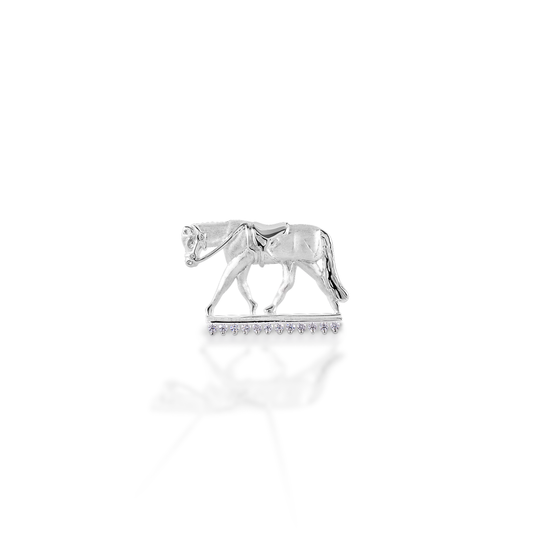 Wear your sport proudly! The Kelly Herd English Horse Pendant features a finely detailed trotting horse in English tack. Made in brushed 14K gold, with the "ground" enhanced with diamonds.  Features      English horse pendant     Enhanced with diamonds     Available in 14K gold     27mm x17mm