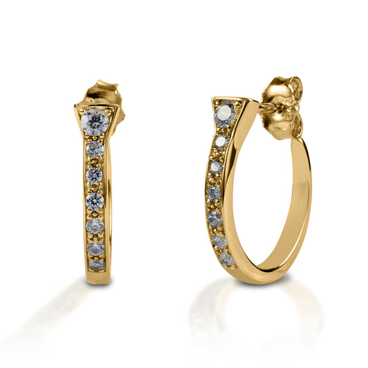 Kelly Herd Horseshoe Nail Earrings offer a classic hoop earring style, with an equestrian nod. Made of white or yellow gold horseshoe "nails" enhanced with diamonds these earrings will complement almost any fashion style. Post back.  Features      Horseshoe nails curved into a hoop style     Diamonds     Available in white, or yellow 14k gold     Hoop with post back     5mm x 19mm