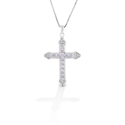 The Kelly Herd Clear Cross is a traditional St. Thomas style cross fashioned in sterling silver with clear CZ stones. Comes with an adjustable 16-18" chain.  Features      Traditional cross pendant     Clear CZ stones     Sterling silver     Comes with adjustable 16-18" chain     29mm x21mm
