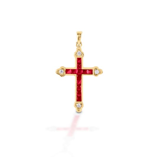 The Kelly Herd Red Cross is a traditional St. Thomas cross fashioned in 14K gold with rubies and diamonds.  Features      Traditional cross pendant     Ruby and diamonds     Available in 14K gold     29mm x 21mm