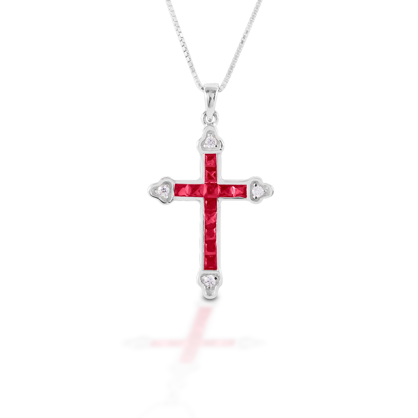 The Kelly Herd Red Cross is a traditional St. Thomas cross fashioned in sterling silver with red and clear CZ stones. Comes with an adjustable 16-18" chain.  Features      Traditional cross pendant     Red and clear cubic zirconia stones     Sterling Silver     Comes with adjustable 16-18" chain     29mm x 21mm