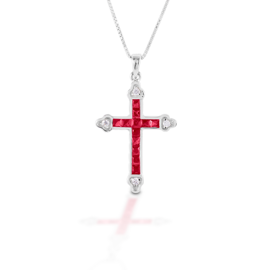 The Kelly Herd Red Cross is a traditional St. Thomas cross fashioned in sterling silver with red and clear CZ stones. Comes with an adjustable 16-18" chain.  Features      Traditional cross pendant     Red and clear cubic zirconia stones     Sterling Silver     Comes with adjustable 16-18" chain     29mm x 21mm