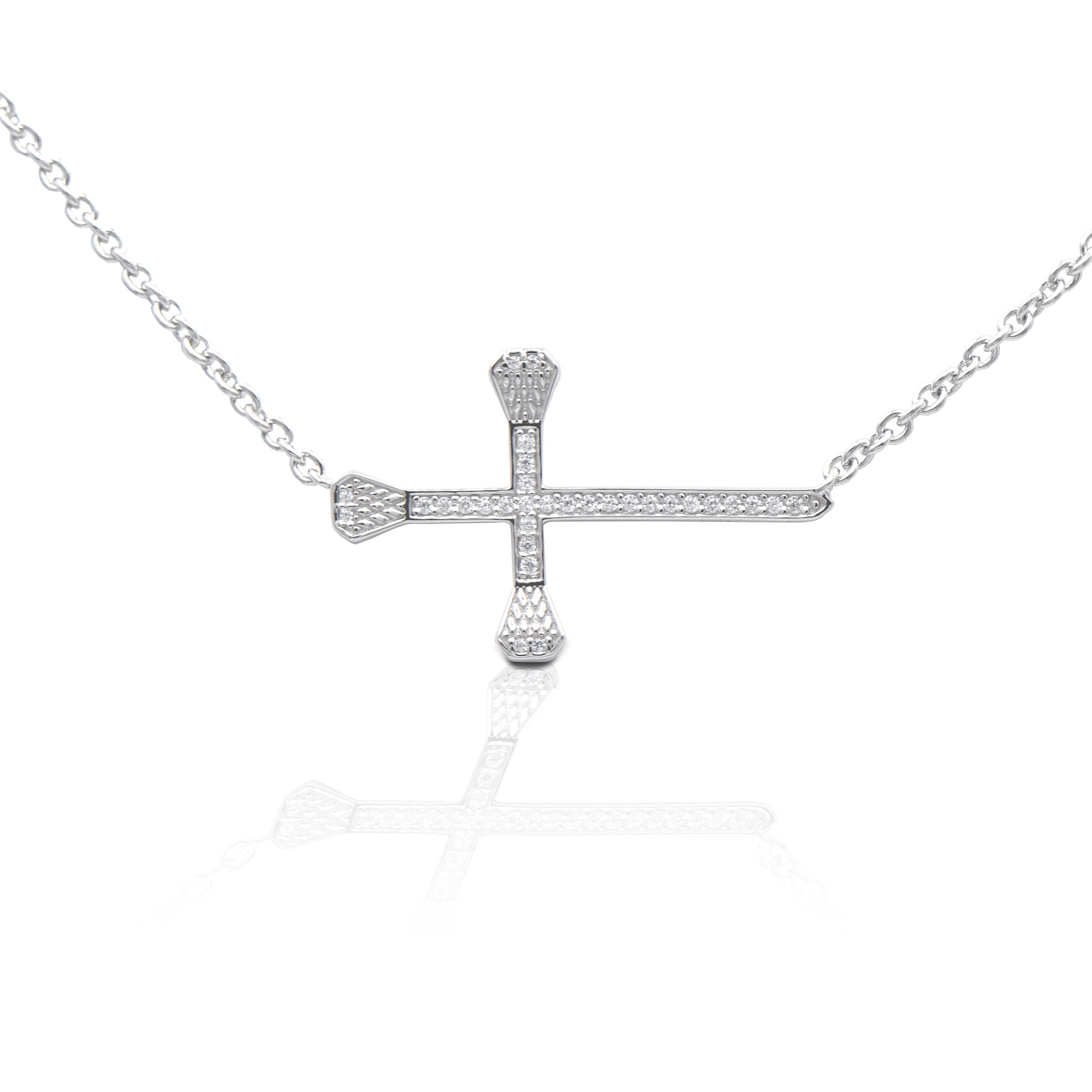Kelly Herd's Horizontal Pavé Horseshoe Nail Cross necklace is both beautiful to look at and beautifully symbolic. The message of faith and horses is clear with the use of horseshoe nails making the cross. Made of sterling silver; enhanced with clear cubic zirconia stones. The attached chain is adjustable from 16-18".  Features      Cross made of horseshoe nails     Pavé clear CZ stones     Sterling Silver     Adjustable 16-18" chain     29mm x 18mm