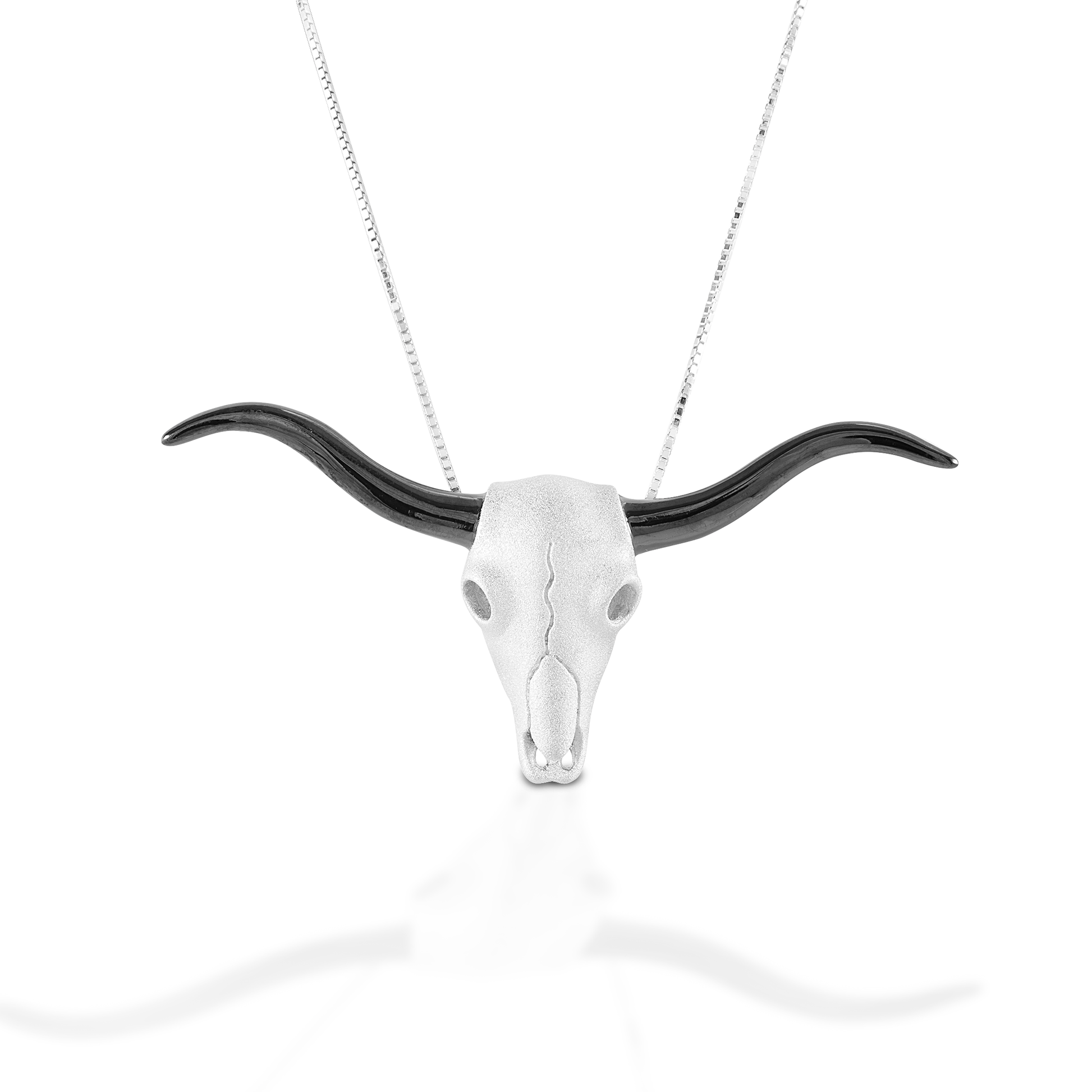 In a nod to a classic Southwest motif, the Kelly Herd Longhorn Skull Necklace features an incredibly detailed long horn skull a brushed surface and shiny black horns. Sterling Silver. Comes with adjustable 16-18" chain.  Features      Long horn skull pendant     Sterling Silver     Comes with adjustable 16-18" chain     55 mm x 25 mm