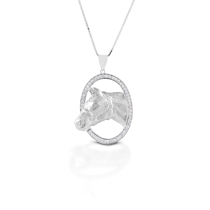 If you are a stock horse aficionado, then the Kelly Herd Circle Halter Horse is for you! This beautifully rendered pendant features a silhouette of a halter horse in an oval frame of cubic zirconia. Sterling Silver Adjustable 16-18" chain.  Features      Stock horse pendant     Accented with clear CZ stones     Sterling Silver     Adjustable 16-18" chain     35mm x 27mm