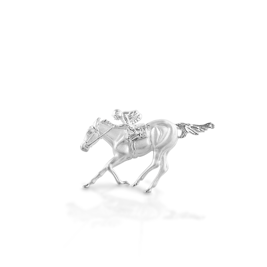 he Kelly Herd Race Horse & Jockey Pendant is remarkably detailed, right down to the folds in the jockey's silks! Made in 14K gold, this necklace will be a favorite for a lifetime.  Features      Race horse and jockey pendant     Available in 14k gold     50mm x 30mm