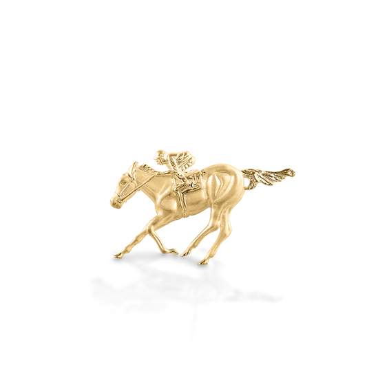 he Kelly Herd Race Horse & Jockey Pendant is remarkably detailed, right down to the folds in the jockey's silks! Made in 14K gold, this necklace will be a favorite for a lifetime.  Features      Race horse and jockey pendant     Available in 14k gold     50mm x 30mm