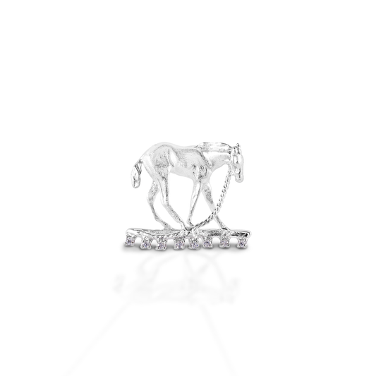 The Kelly Herd Foal & Halter Pendant perfectly captures a moment in the life of a foal, "what is this halter thing they have put on me?!" Beautifully crafted in 14K gold.  Features      Foal pendant     Enhanced with diamonds     Available in 14K gold     15 mm x 22mm