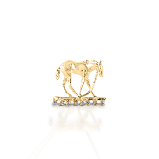 The Kelly Herd Foal & Halter Pendant perfectly captures a moment in the life of a foal, "what is this halter thing they have put on me?!" Beautifully crafted in 14K gold.  Features      Foal pendant     Enhanced with diamonds     Available in 14K gold     15 mm x 22mm