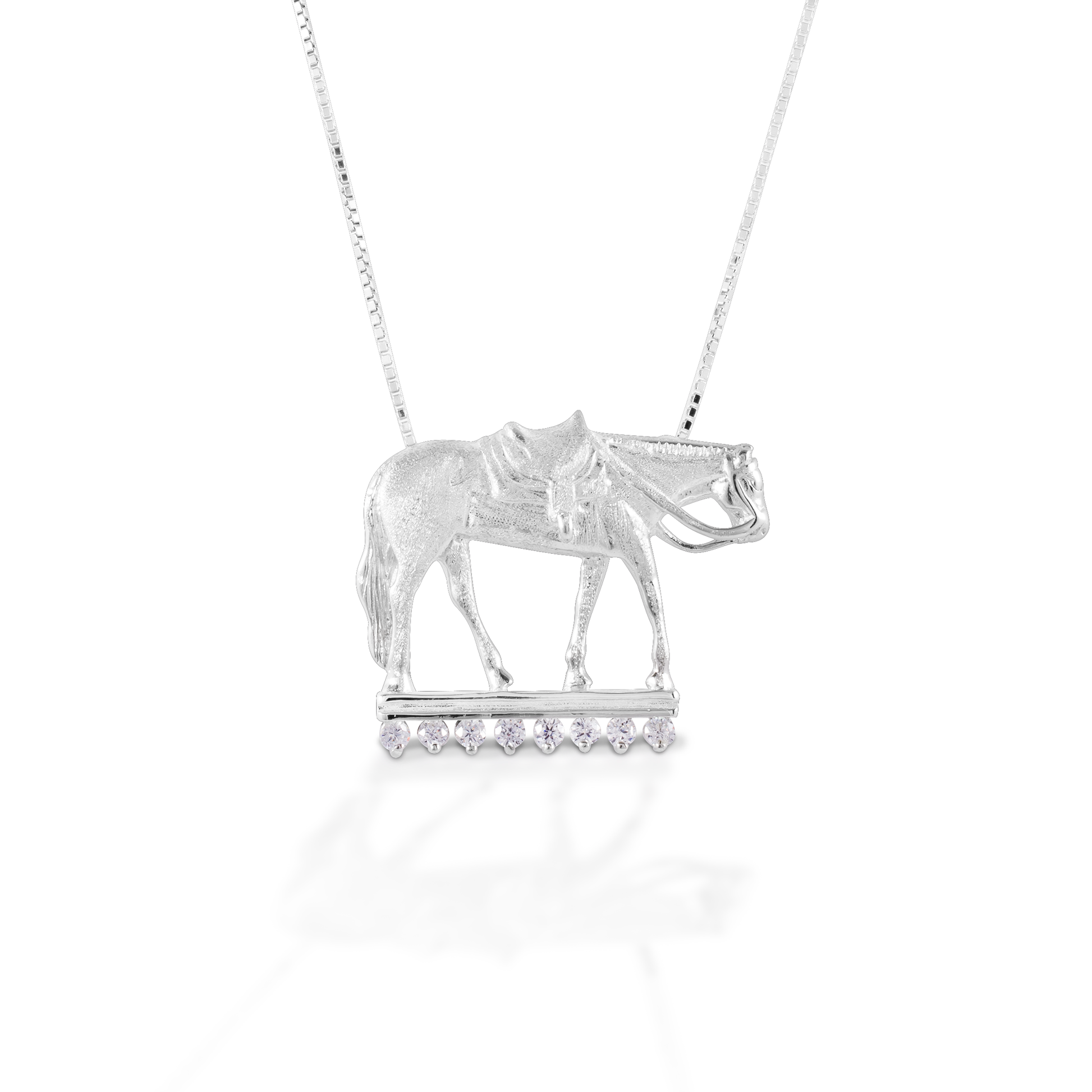 Just for the Western Pleasure rider, Kelly Herd's Pleasure Horse Necklace is beautifully crafted in sterling silver, and enhanced with clear cubic zirconia stones. Comes with adjustable 16-18" chain.  Features      Western pleasure horse pendant     Enhanced with clear CZ stones     Sterling Silver     Comes with adjustable 16-18" chain     34 mm x 22 mm