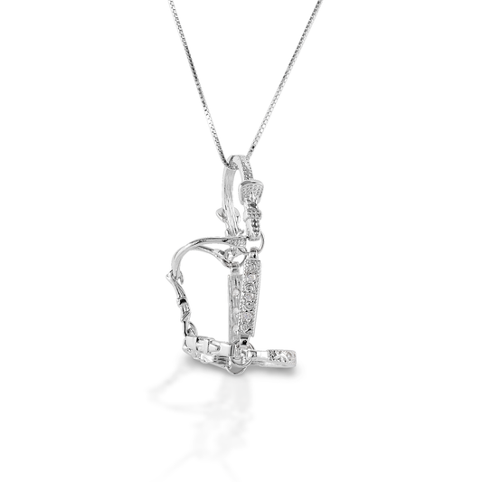 Carry your horse near your heart with the Kelly Herd Large Halter Necklace. This perfectly crafted tiny three-dimensional halter is made of sterling silver, with CZ stones on the cheek pieces and nose band. Comes with a 16"-18" adjustable chain.  Features      Three dimensional halter pendant     Enhanced with clear CZ stones     Sterling Silver     Comes with adjustable 16-18" chain     23 mm x 40 mm