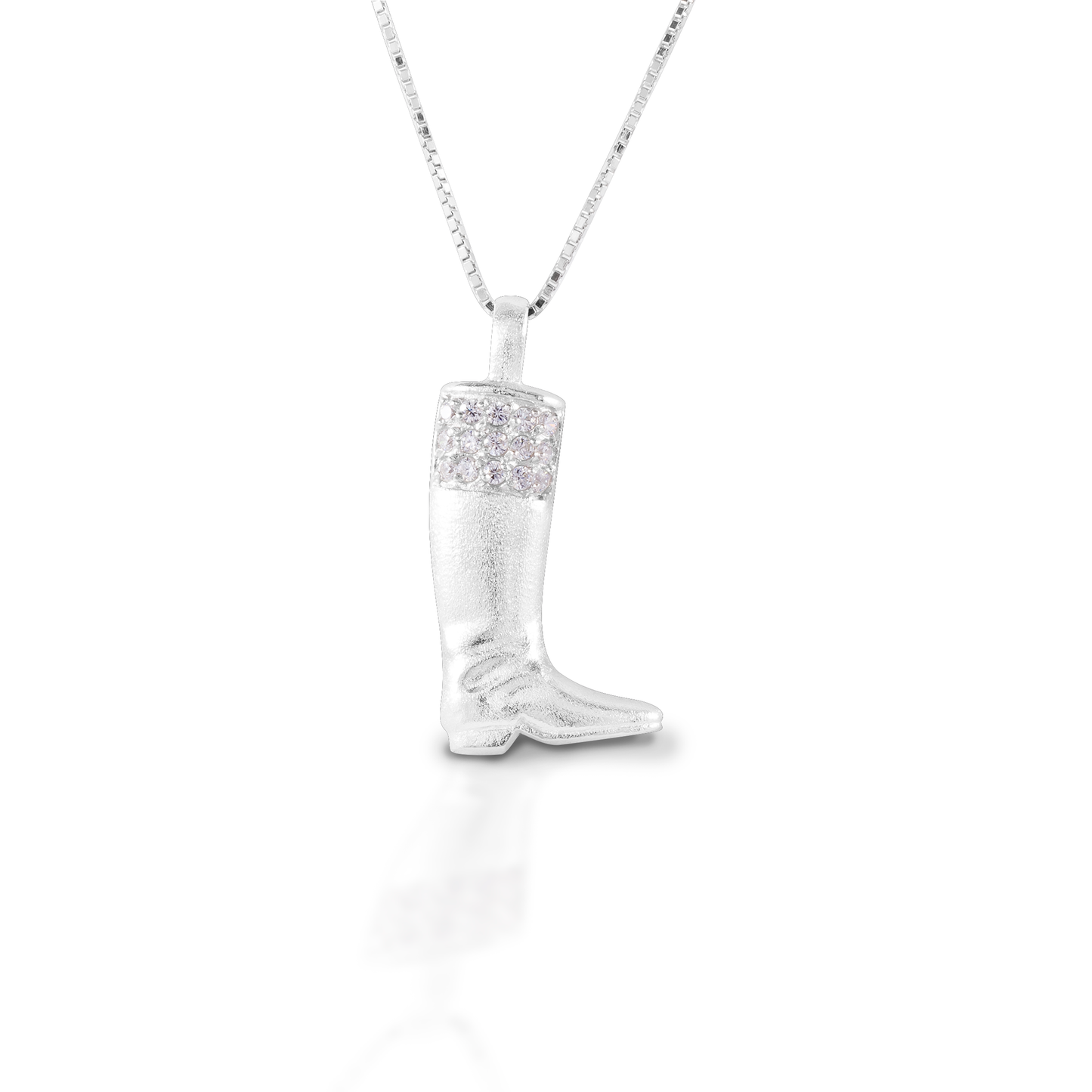 The Kelly Herd English Boot Necklace features a traditional style English boot made of brushed sterling silver and enhanced with CZ. It brings to mind fox hunts, and jockeys and cavalry officers. Comes with a 16"-18" adjustable chain.  Features      English boot pendant     Enhanced with clear CZ stones     Sterling Silver     Comes with adjustable 16-18" chain
