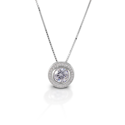 Kelly Herd's Round Bezel Set Pave Necklaces has the kind of pendant you will wear forever! It is classic, elegant, and absolutely timeless! Made of sterling silver with a round bezel set CZ stone. Comes with adjustable 16-18" chain.  Features      Round bezel set pendant     Sterling Silver     Clear CZ stones