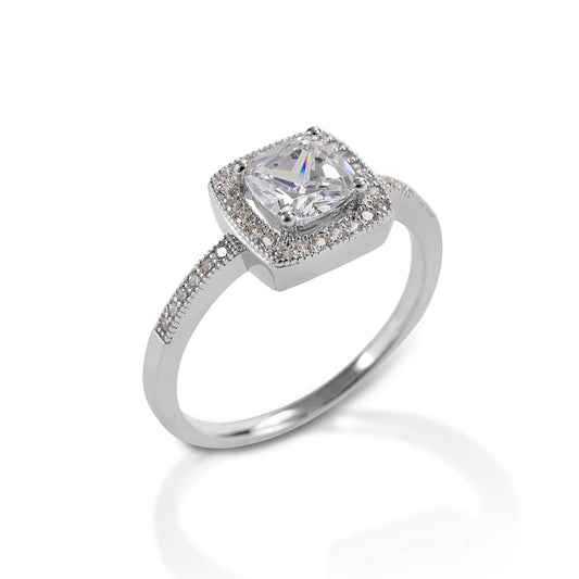 The Kelly Herd Bezel Set Pavé Ring is a classic vintage style. This ring features square bezel set pavé CZ in a sterling silver setting. Matching earrings and necklace are also available.  Features:      Square bezel set ring     Sterling Silver     Enhanced with clear cubic zirconia     10mm x 10mm