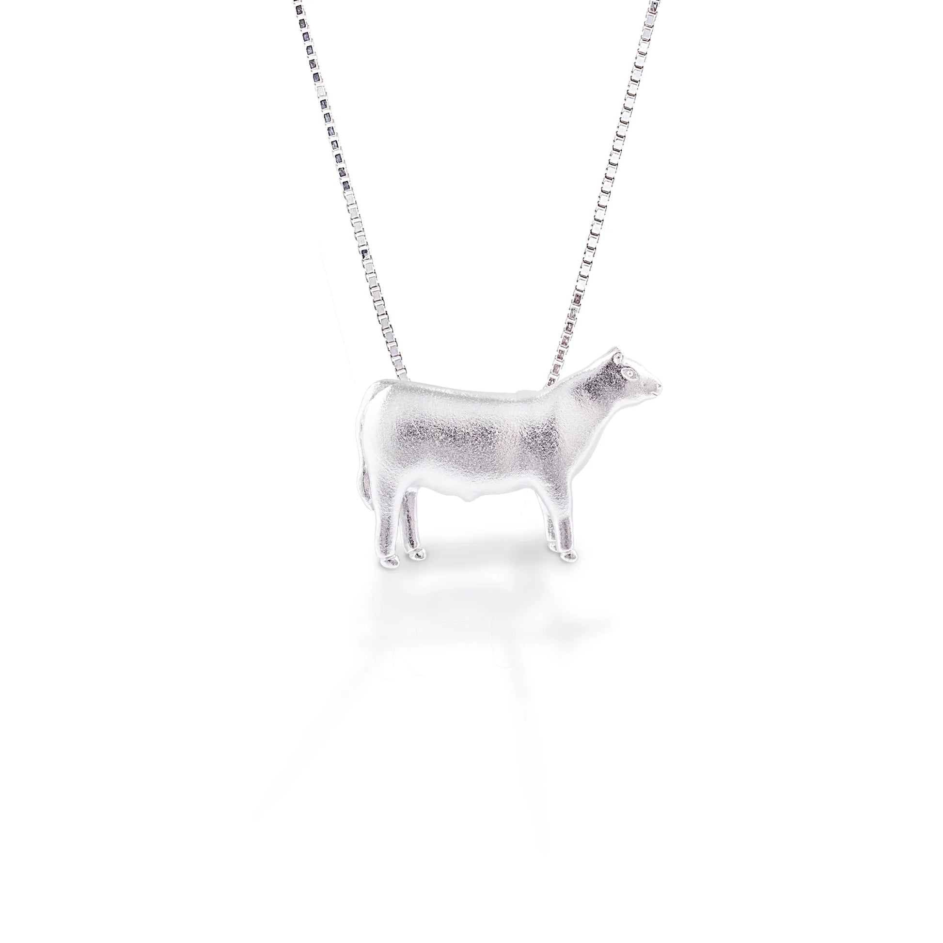 You're not just a cattle rancher, you're a true cowgirl, and you're going to show it by wearing this steer around your neck. It's detailed design makes this piece a great choice for any cattle lover! At home on the ranch or out in town, this steer will be there to remind you of where you came from.  Features      Beautifully Rendered Steer Pendant      Brushed finish      Measures 12 mm x 18 mm      16"-18" Adjustable Box Chain     Sterling Silver