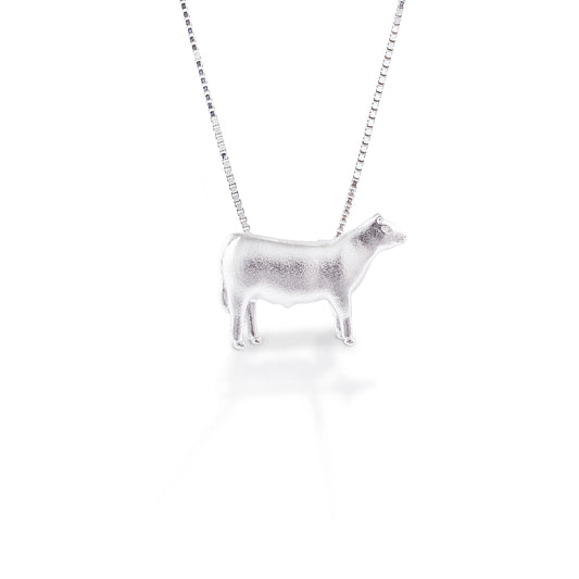 You're not just a cattle rancher, you're a true cowgirl, and you're going to show it by wearing this steer around your neck. It's detailed design makes this piece a great choice for any cattle lover! At home on the ranch or out in town, this steer will be there to remind you of where you came from.  Features      Beautifully Rendered Steer Pendant      Brushed finish      Measures 12 mm x 18 mm      16"-18" Adjustable Box Chain     Sterling Silver