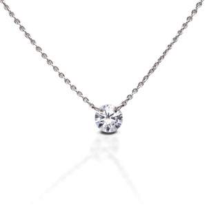 The Kelly Herd Clear Stone Naked Pendant features a 1CT clear cubic zirconia stone, that free floats on the sterling silver chain. This necklace is sure to catch everyone's eye as it shimmers in the light. This necklace features a 16"-18" adjustable chain, making it perfect to wear with any outfit.  Features      1 CT Clear Cubic Zirconia     Free Floating Stone     Matching Earrings Available     Available in Sterling Silver