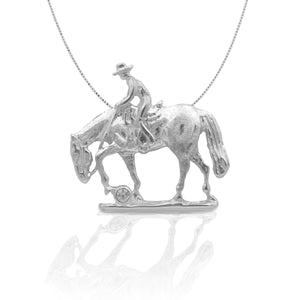     Beautifully Rendered Trail Horse Design     Accented with Clear Cubic Zirconia Stone     Measures 30mm high x 30mm wide     16"-18" Adjustable Box Chain     Matching Earrings Available     Sterling Silver