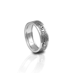 The Kelly Herd Men's Engraved Western Wide Band Ring evokes the style of hand tooled leather. The engraved sterling silver design is perfect as an everyday ring or could serve as a wedding band giving a subtle hint to an equestrian lifestyle. Whether out in the field, or in the board room negotiating, this sturdy ring is sure weather any storm.  Features      Engraved Western Motif     Available in Sizes 10-13     Comfort Fit Band     Sterling silver     Measures 7mm wide